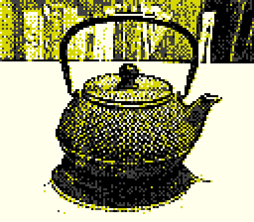 game boy photo of a cast iron japanese tea kettle, in black and gold