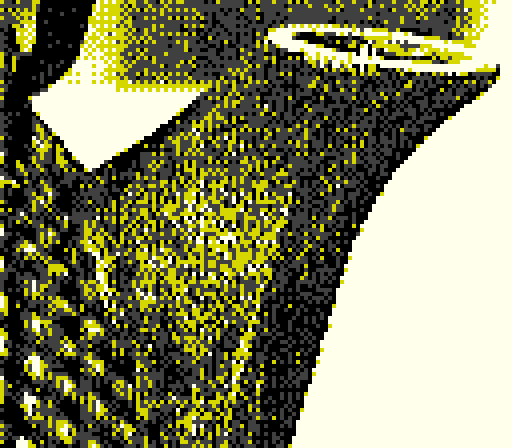 game boy photo of a japanese tea kettle spout, in black and gold