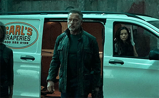 Carl from Terminator Dark Fate, in front of his white van
